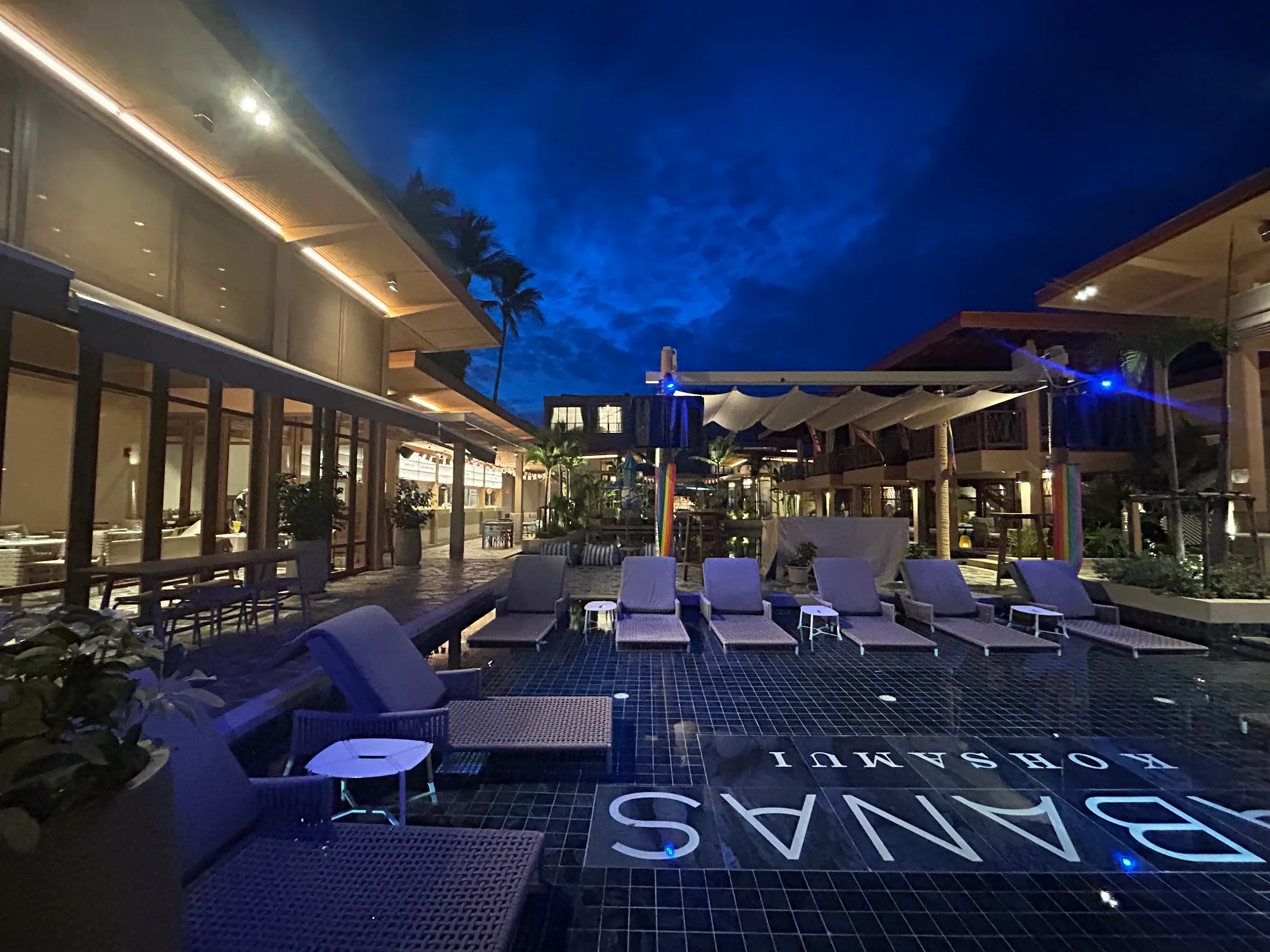 Cabanas Beach Club Koh Samui pool with blue lighting at night