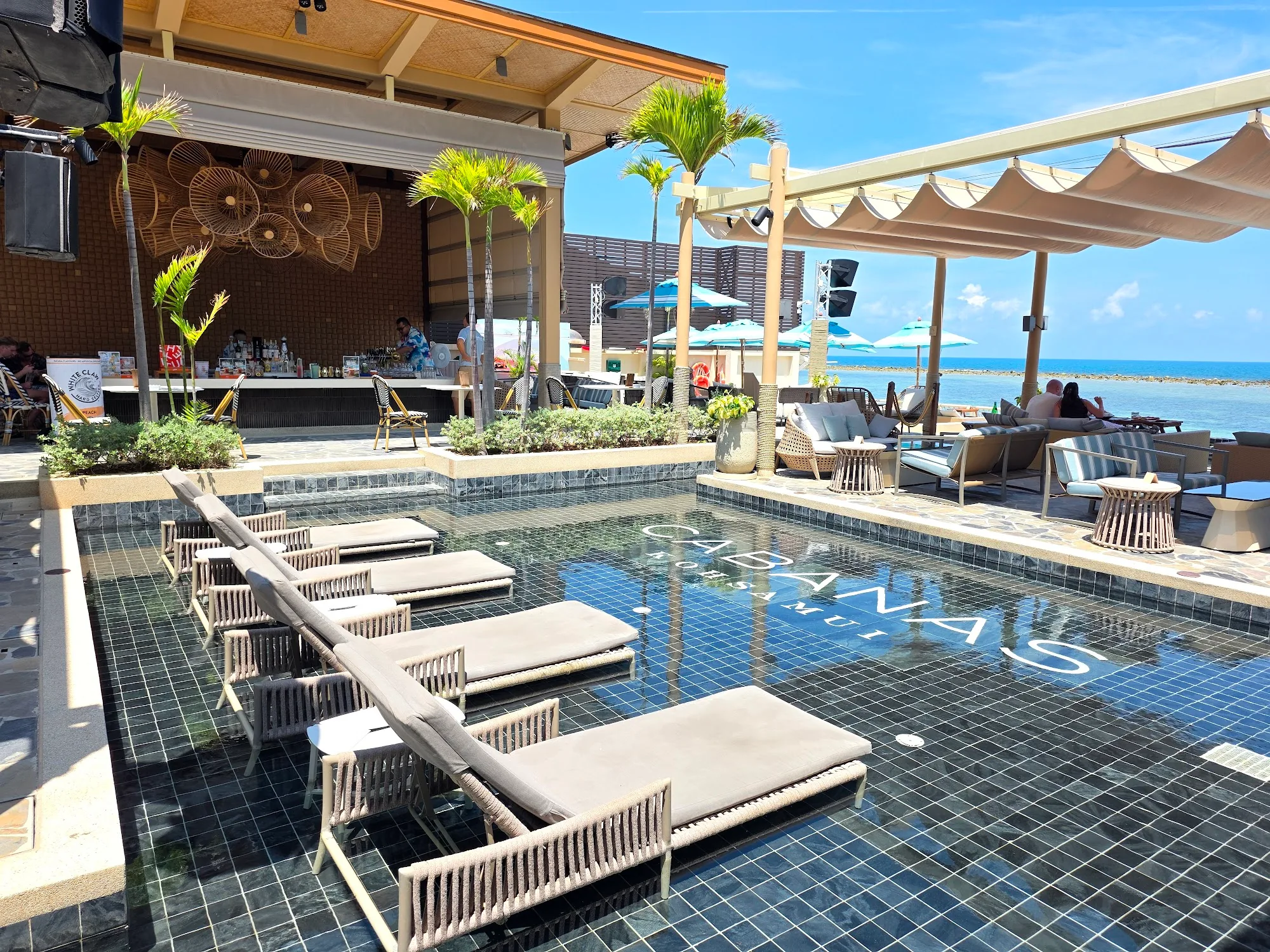 Cabanas Beach Club Koh Samui pool with sun loungers during daytime