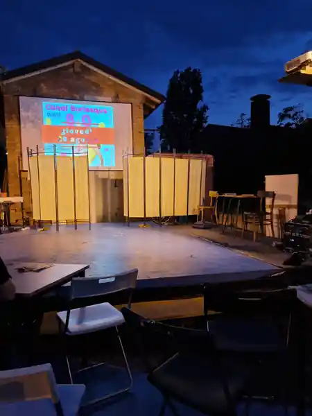Battiferro live band on outdoor stage with audience — salsa, bachata, kizomba venue in Bologna