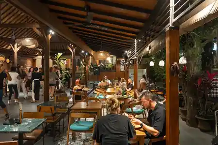 Social dancing at Pilleyar Bar & Kitchen in Bali with couples on the dance floor during a lively evening event — salsa, bachata, kizomba venue in Bali