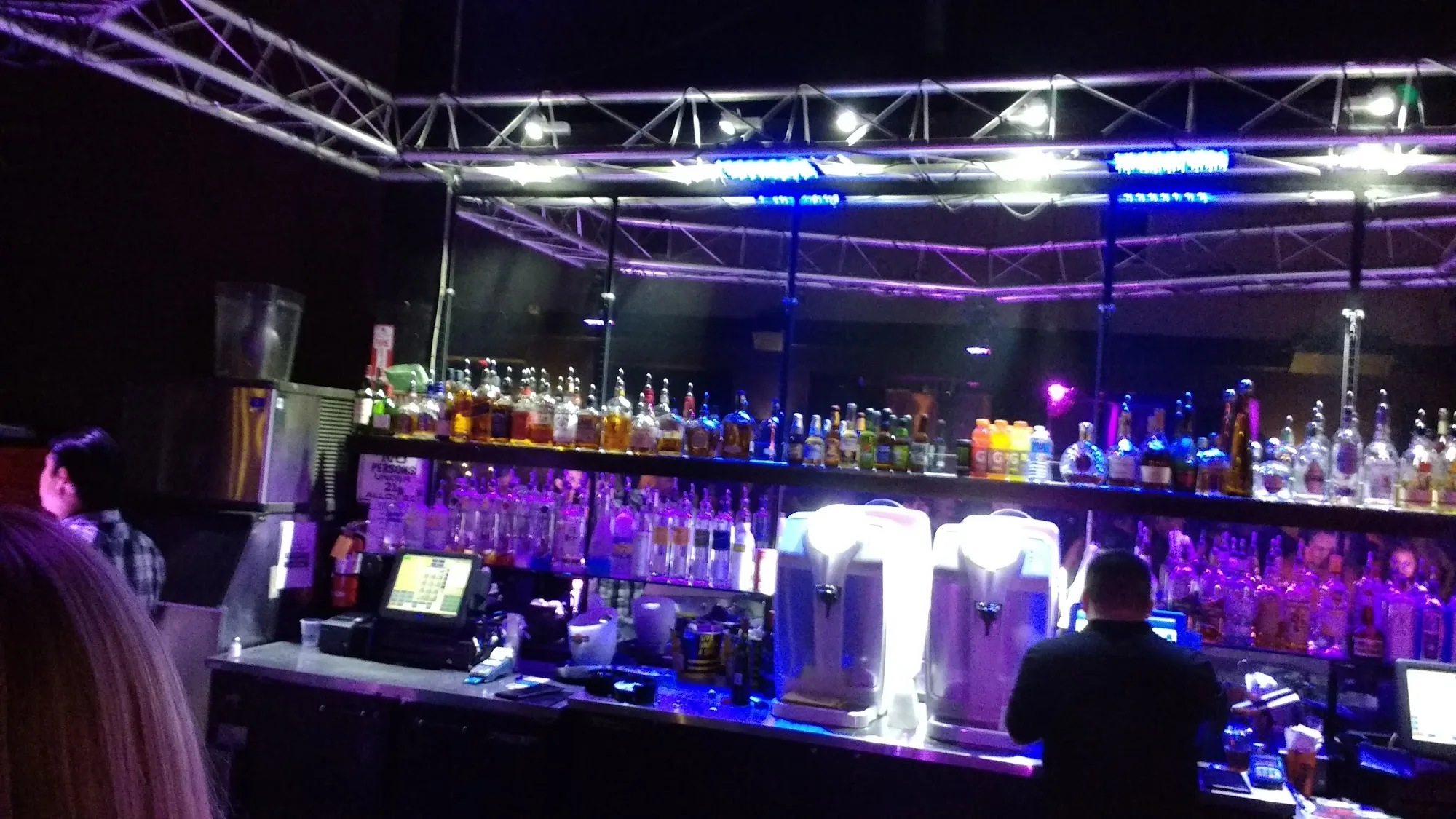 Bar with truss lighting and full liquor selection at Space 550 dance club in San Francisco