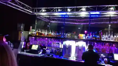 Bar with truss lighting and full liquor selection at Space 550 dance club in San Francisco — salsa, bachata venue in San Francisco