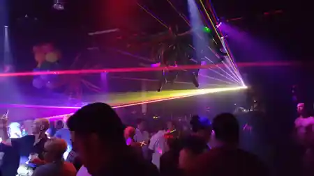 Laser light show over the crowd on a Latin dance night at Space 550 in San Francisco — salsa, bachata venue in San Francisco