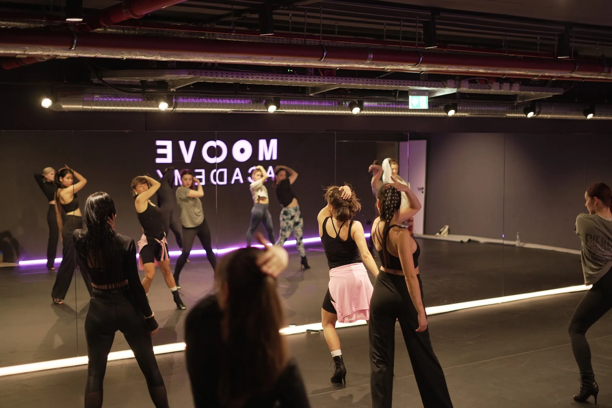 Group dance class training in front of mirrored studio wall at Mice Dance School Munich