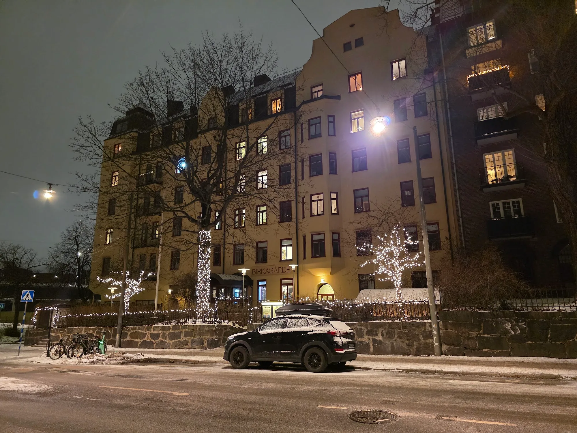 Birkagården building exterior at night with Christmas lights in winter Stockholm
