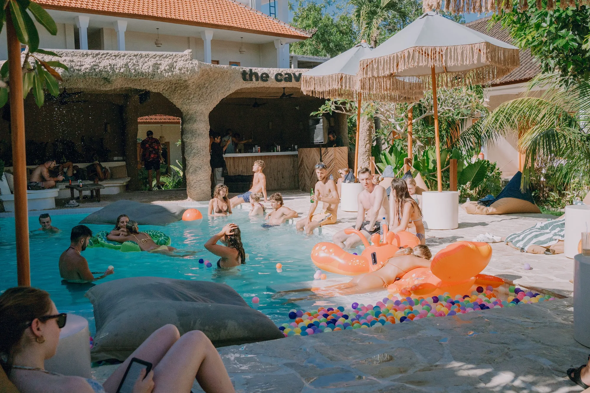 Pool party crowd at the Cave bar at Mad Monkey Uluwatu, Bali