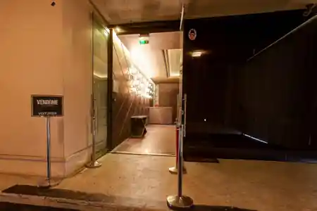 Branded entrance of Vendôme Club Paris with illuminated corridor — salsa, bachata venue in Paris