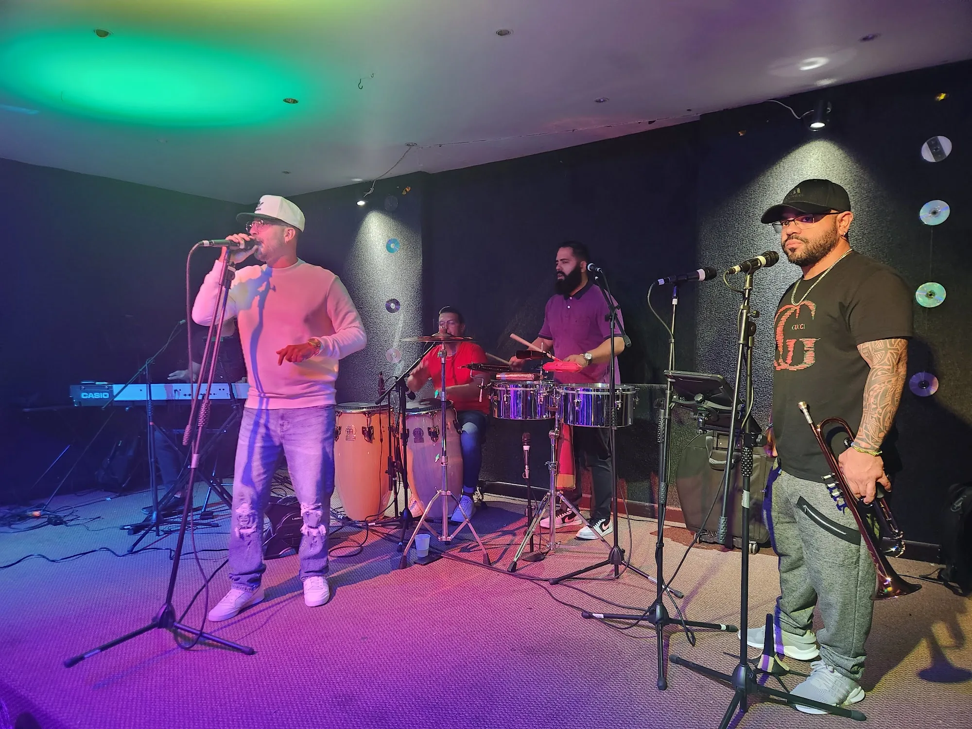 Live salsa band performing on stage at Música Bar Lounge San Juan