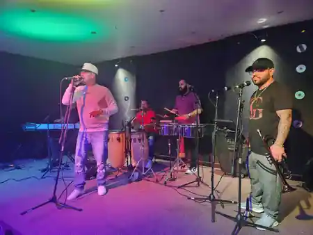 Live salsa band performing on stage at Música Bar Lounge San Juan