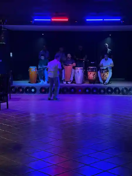 Empty dance floor and conga band on stage at Música Bar Lounge San Juan — salsa venue in San Juan