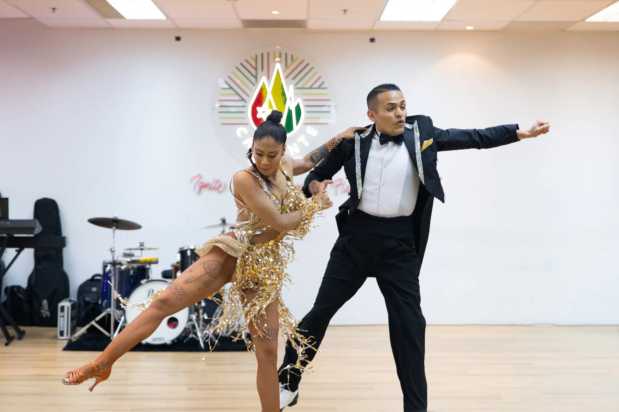 Salsa partner dancers performing at Caliente Dance Studio Singapore
