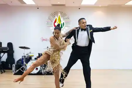 Salsa partner dancers performing at Caliente Dance Studio Singapore
