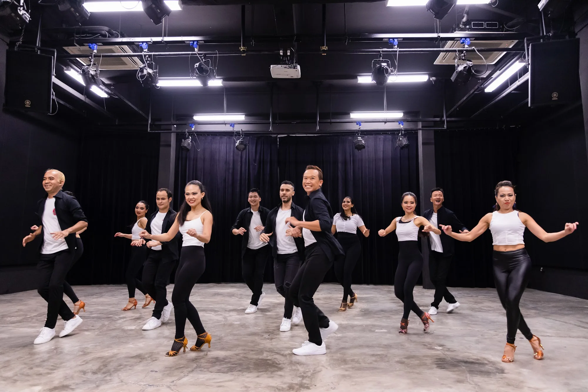 Dance class group performing choreography at Caliente Dance Studio Singapore