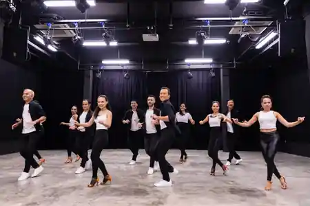 Dance class group performing choreography at Caliente Dance Studio Singapore — salsa, bachata venue in Singapore