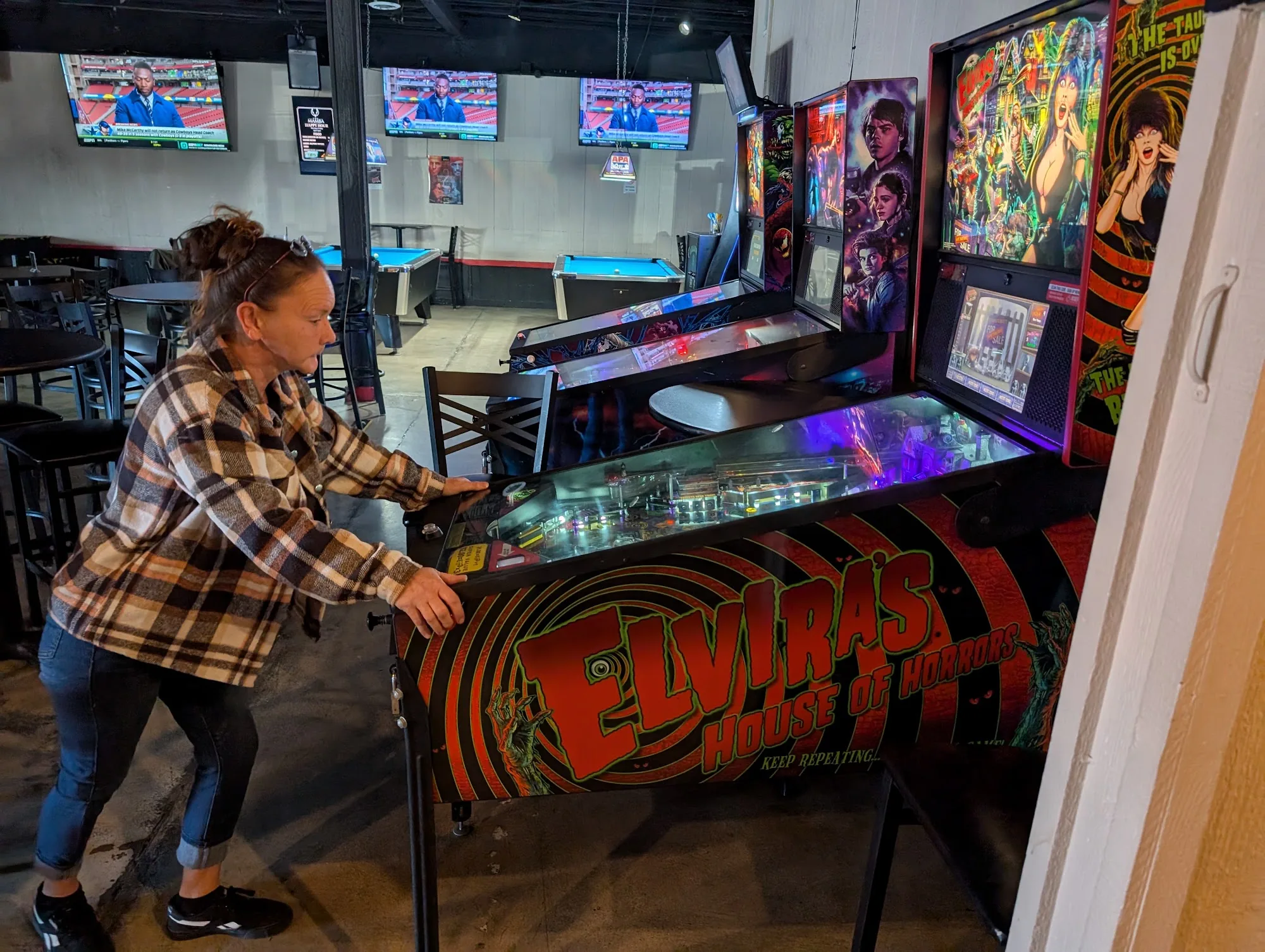 Interior with pool tables, pinball and sports TVs at The Mamba in Huntington Beach