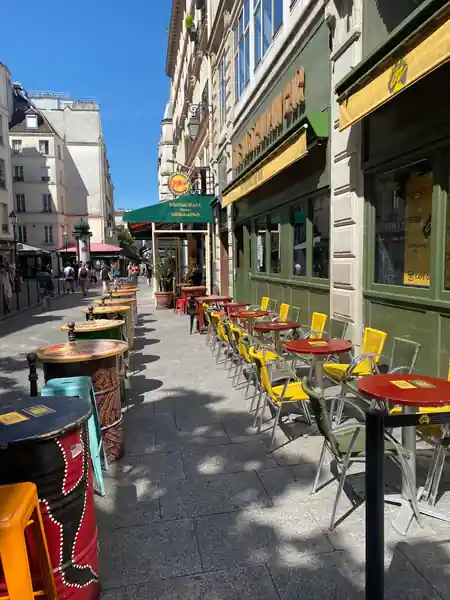 Café Oz Chatelet outdoor terrace with colorful seating on Paris street — salsa venue in Paris