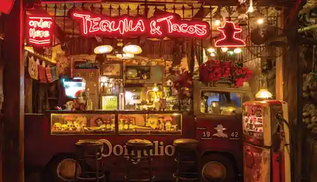 Tequila and Tacos neon-lit bar truck inside La Favela Bali — salsa, bachata venue in Bali