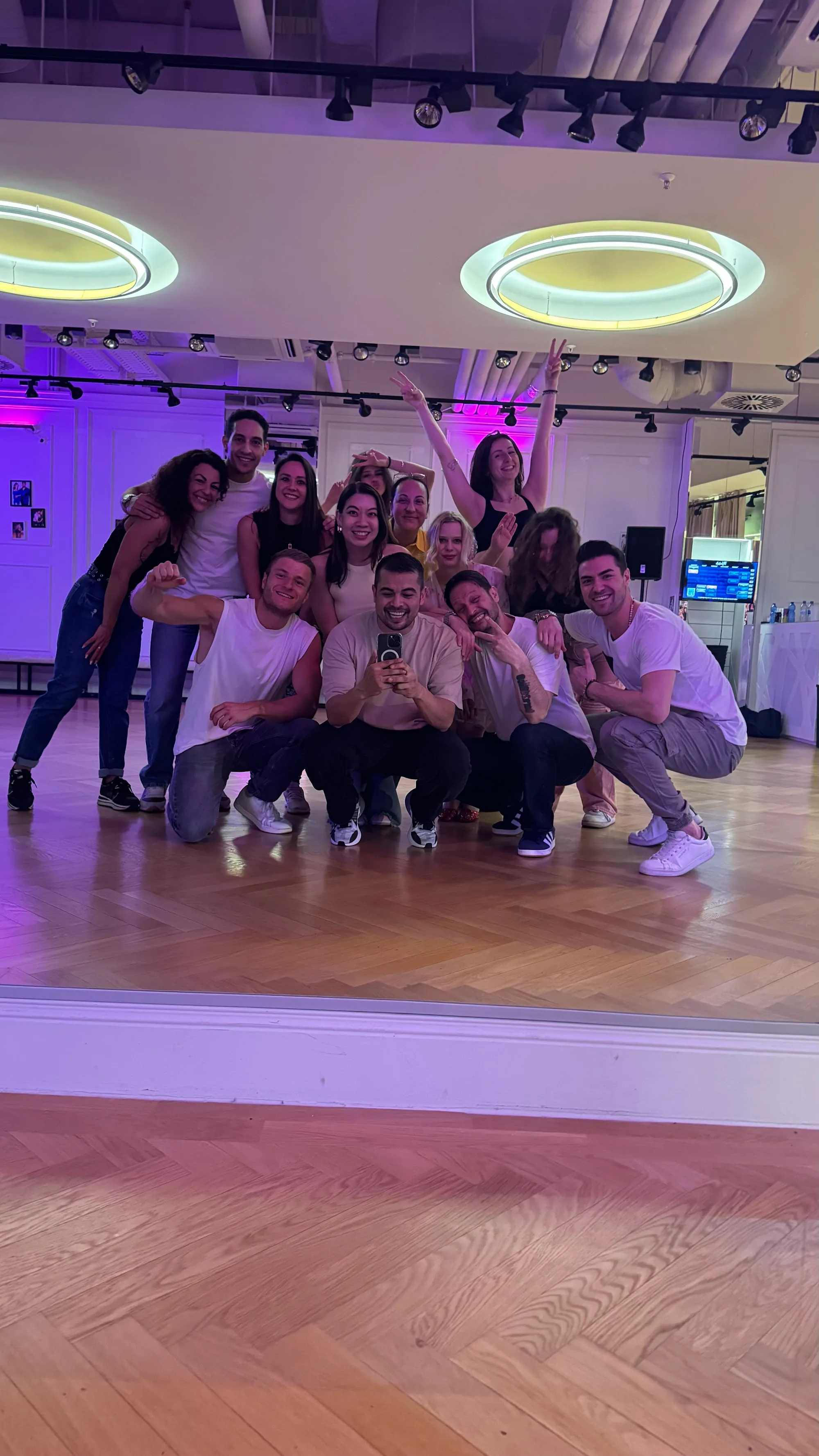 Dance students and instructor group photo at Movida Frankfurt mirrored studio