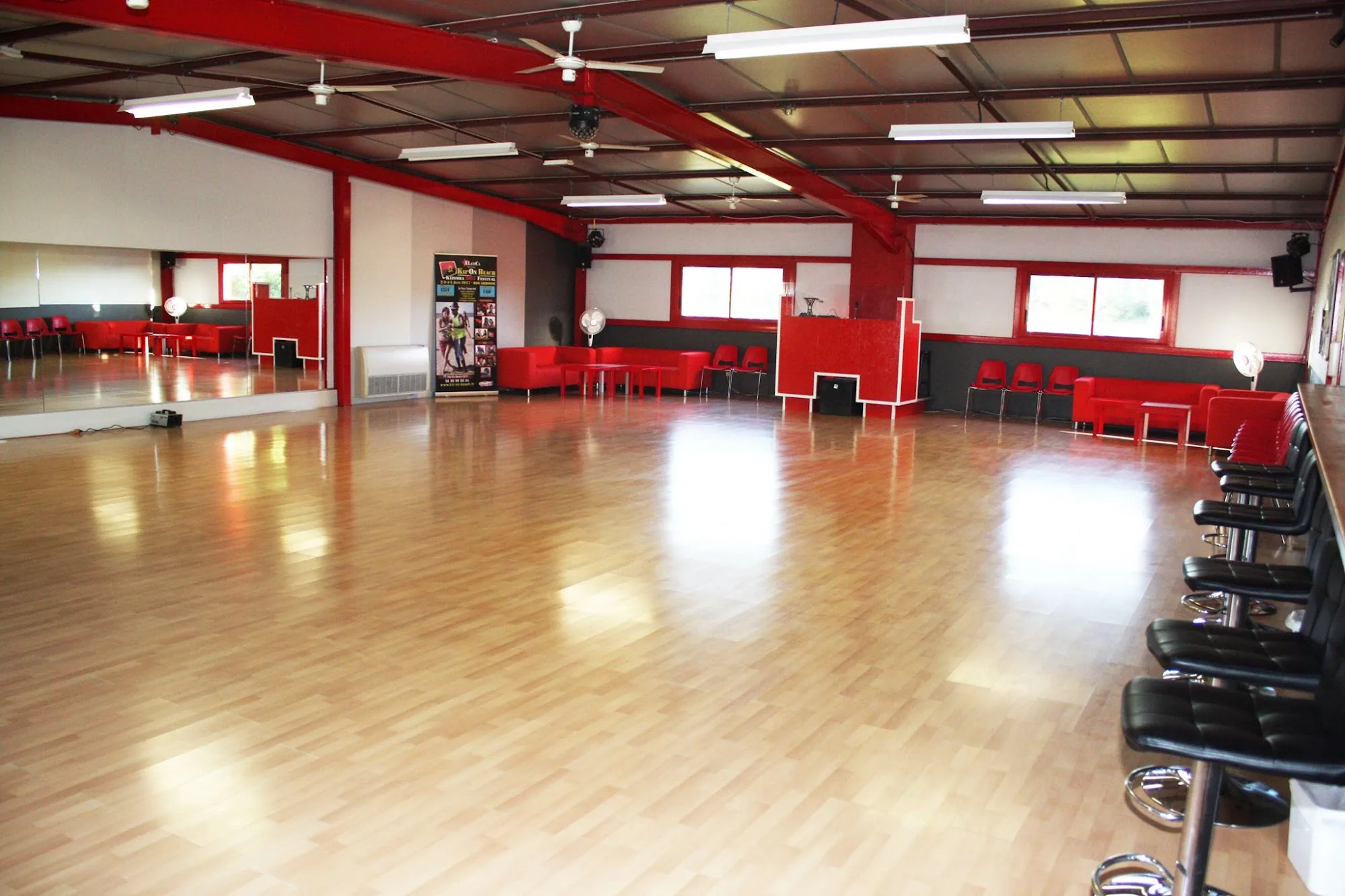 Empty dance studio with wooden floor and mirrors at Salle Le Temple Pessac France