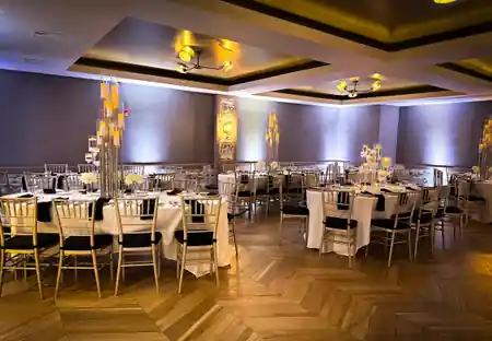 Elegant event room with chandeliers and chevron floor at K. Pacho New York — salsa, bachata venue in New York