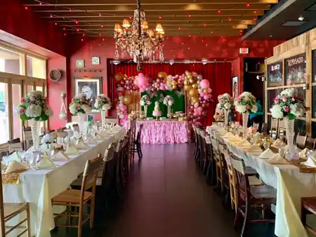 Decorated dining hall with chandeliers and floral arrangements at K. Pacho New York — salsa, bachata venue in New York
