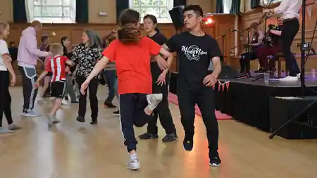 Dancers on the wooden dance floor with live band at Cecil Sharp House, London — salsa, bachata venue in London