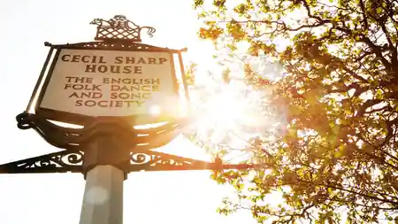 Cecil Sharp House exterior sign in the sunlight, home of the English Folk Dance and Song Society in London — salsa, bachata venue in London