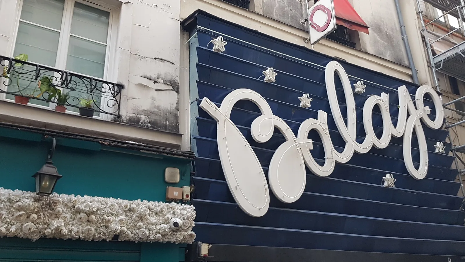 Daytime exterior of Le Balajo showing the Balajo sign on a Paris street