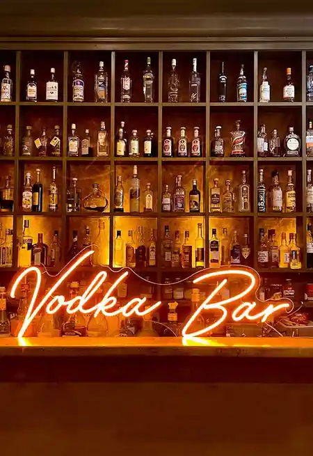 Vodka Bar neon sign glowing over the bottle wall at Vodka Temple in Melbourne, bachata venue in Melbourne