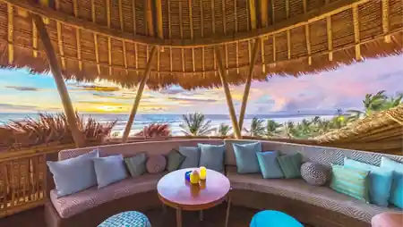 Azul Beach Club oceanfront view with palm trees, Legian Beach, Bali — salsa, bachata, kizomba venue in Bali