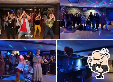 Salsa dance class and social dancing at Sandunga Caribbean Club in Malaga with dancers on the floor