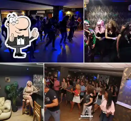 Social dance event at Sandunga Caribbean Club Malaga with couples dancing salsa on the dance floor