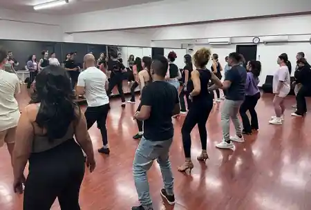 Group salsa class at ALMA studio in Sydney with dancers on the dance floor