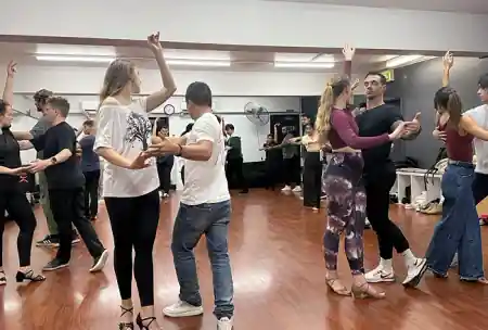 Social dance class at ALMA studio in Sydney with couples practicing partner dancing — zouk venue in Sydney
