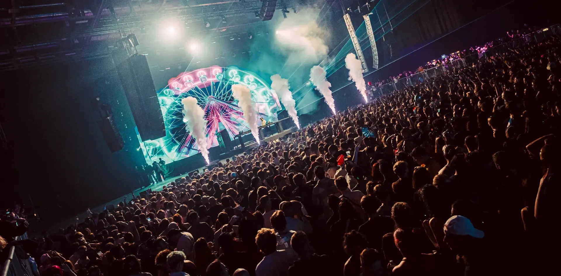 Packed crowd and stage lights at Village du Soir nightclub in Geneva