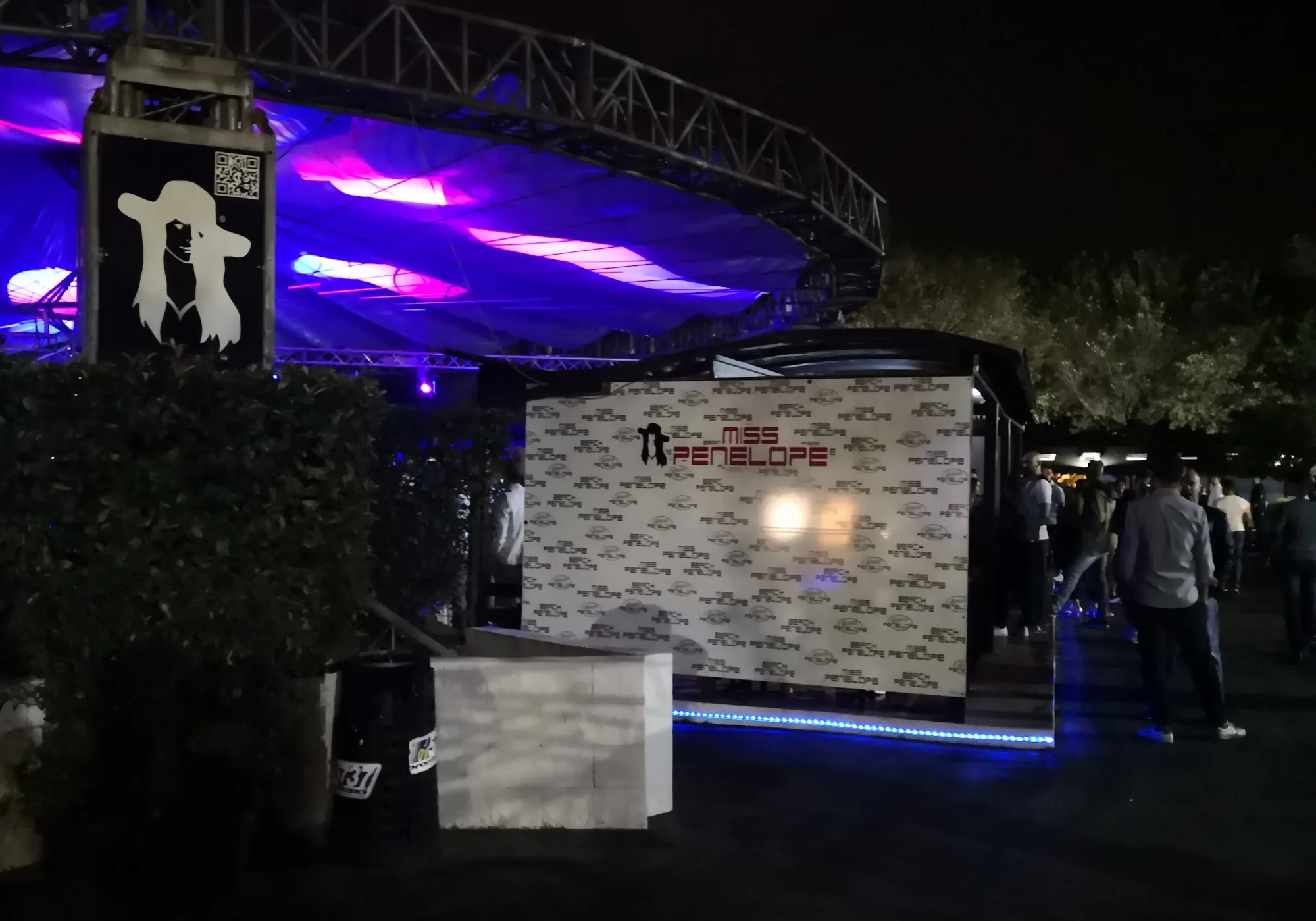 Penelope Beach Torino — outdoor venue entrance at night with Miss Penelope branding and stage structure