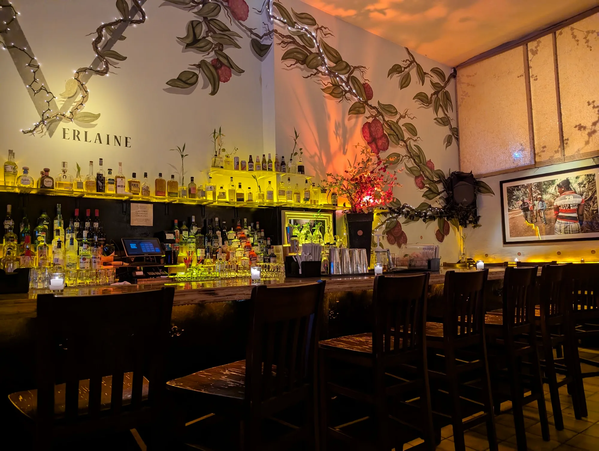 Bar interior with Verlaine branding and atmospheric lighting in New York