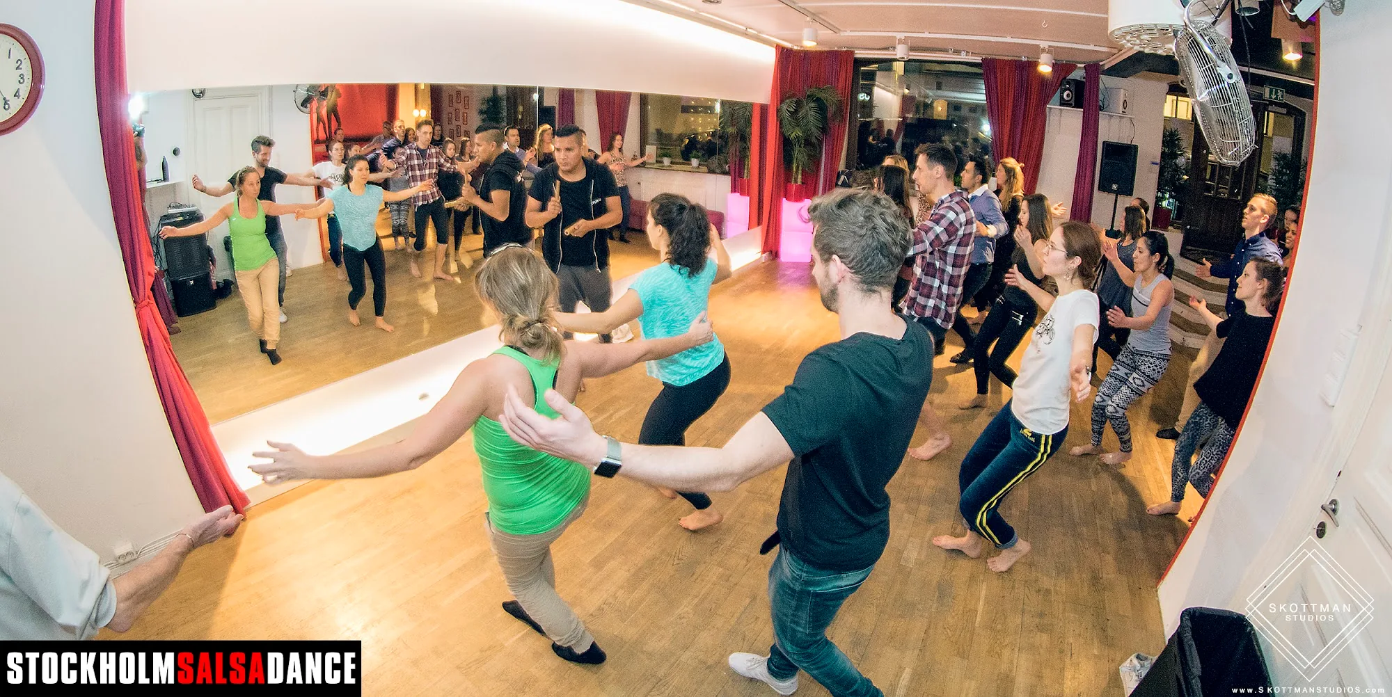 Group salsa class in progress at Stockholm Salsa Dance