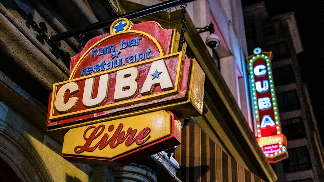 Illuminated neon CUBA Libre rum bar signs at night in Washington, D.C.