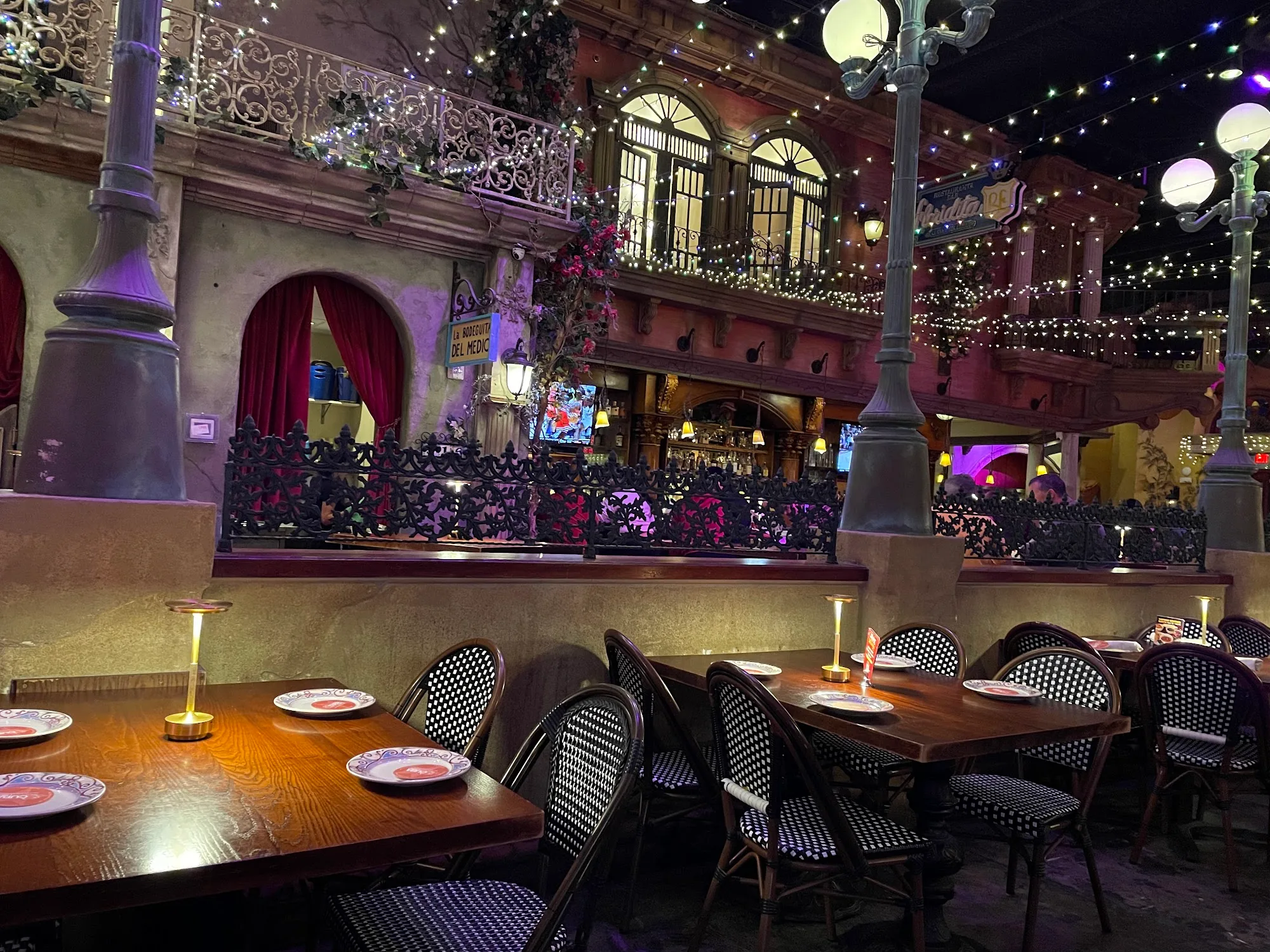 Ornate Cuban-style courtyard interior with string lights and balconies at Cuba Libre Restaurant & Rum Bar, Washington, D.C.