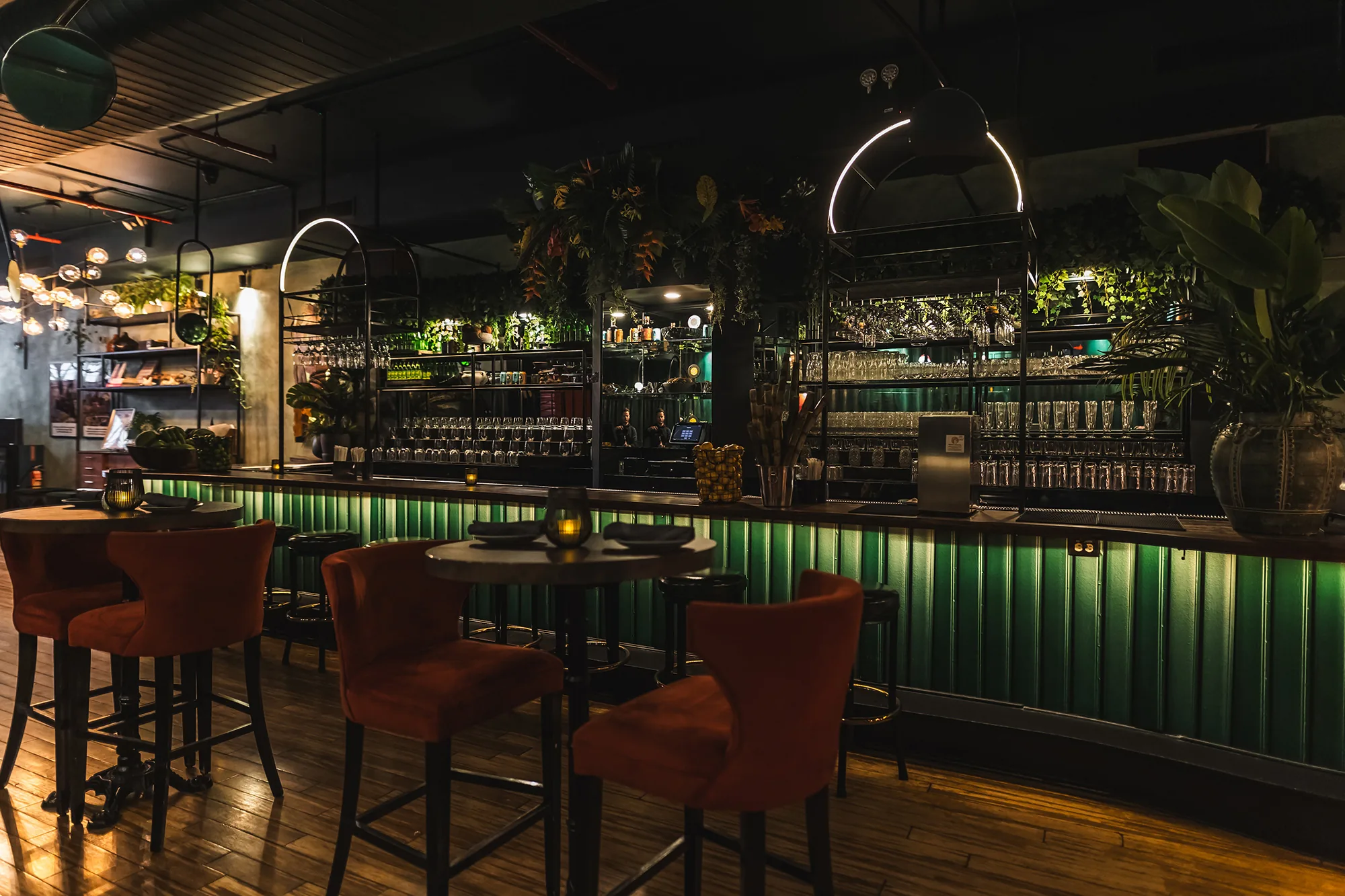 Green-tiled bar and lounge seating at Negril Village in New York