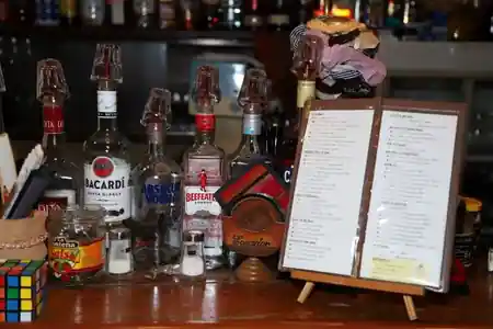 Las Risas bar counter with rum selection in Ginza, Tokyo — intimate Latin dance and music venue, salsa, bachata venue in Tokyo