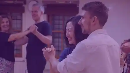 Couples dancing together and smiling during a Latin dance class at Rio Rhythmics Latin Dance Academy in Brisbane — salsa, bachata, zouk, kizomba venue in Brisbane