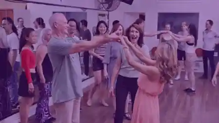Dancers enjoying a lively Latin dance social at Rio Rhythmics Latin Dance Academy in Brisbane, with multiple couples practicing on the studio floor — salsa, bachata, zouk, kizomba venue in Brisbane