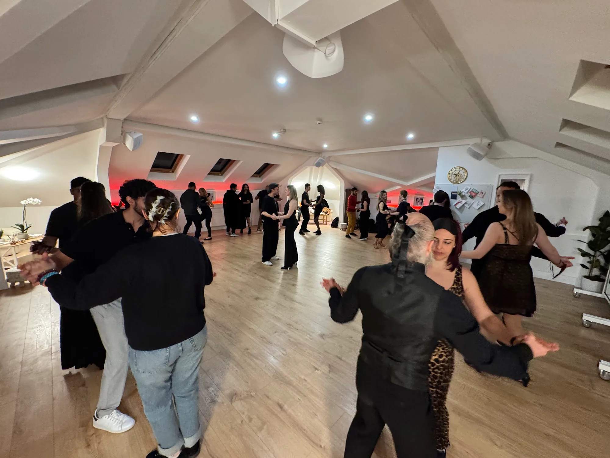 Beyond Dance Dublin social dancing with packed floor and red ambient lighting