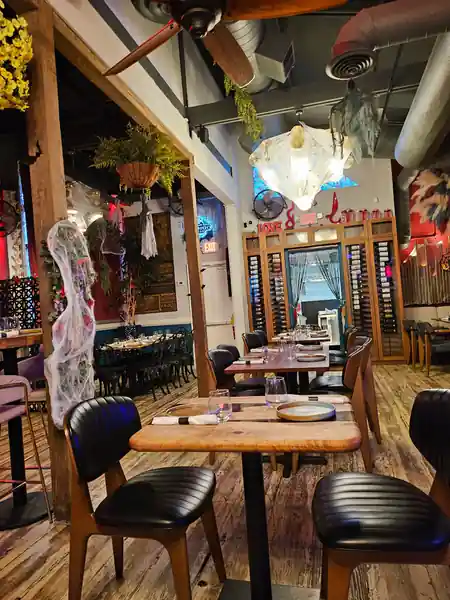 Restaurant interior with wooden tables at Sebastián Pintxos Bar Atlanta — salsa, bachata venue in Atlanta