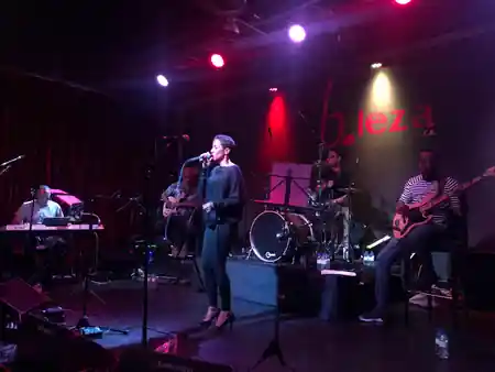 B.Leza live band performing on stage with b.leza logo visible — kizomba venue in Lisbon