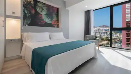 Occidental Las Palmas Hotel room with sea view over Las Palmas marina and Gran Canaria mountains — salsa, bachata, kizomba venue in Las Palmas de Gran Canaria