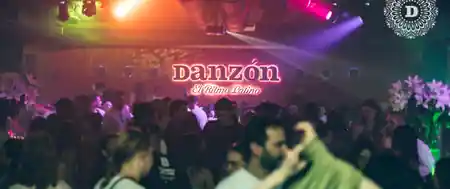 DANZON Latin Club dance floor in Vienna with crowd dancing under colorful lights — bachata, salsa venue in Vienna