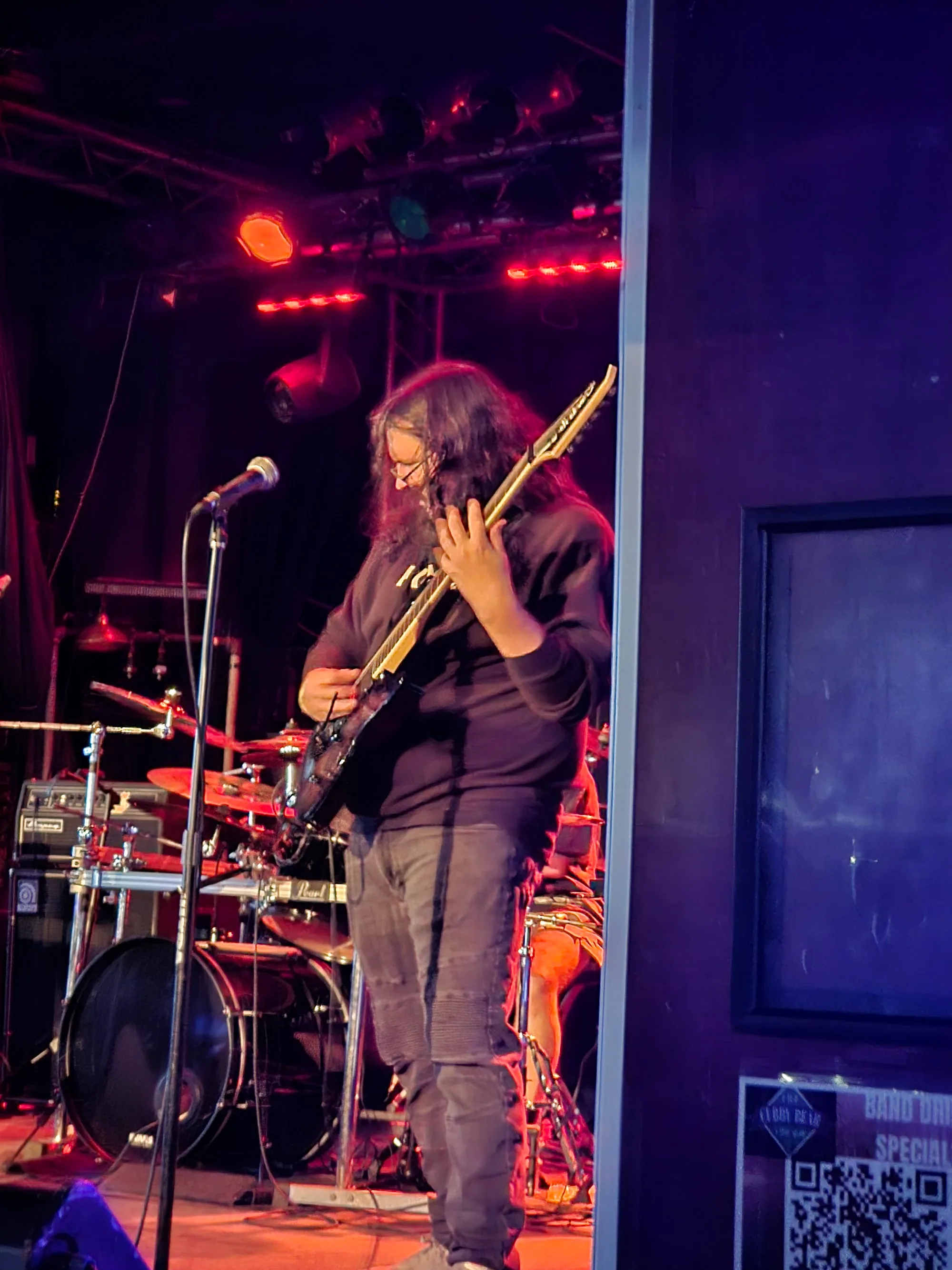 Live band performing on the lit stage at The Cubby Bear in Chicago
